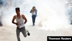 Israeli soldier killed by rock thrown during West Bank raid.