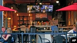 People gather at the North Shore Tavern in Pittsburgh on June 28, 2020. 