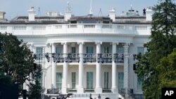Lights and staging stand on the South Lawn of the White House, Aug. 21, 2020, in Washington. President Donald Trump is expected to speak to the Republican National Committee convention next week from the South Lawn of the White House.