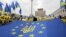 FILE - Pro-European Union activists rally in the center of Kyiv, Ukraine's capital, Oct. 30, 2013.