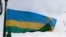 FILE - The Rwandan flag flies in the grounds of the Commonwealth Secretariat at Marlborough House, in London, on March 8, 2010, 