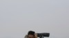 FILE - A South Korean army soldier watches the North Korea side from the Unification Observation Post in Paju, South Korea, near the border with North Korea, Dec. 25, 2019. 