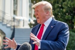 FILE - President Donald Trump speaks to members of the media on the South Lawn of the White House in Washington, Aug. 7, 2019.