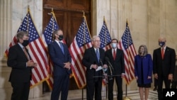 Senate Majority Leader Mitch McConnell speaks to reporters following a closed-door meeting where the Republican Conference held leadership elections, on Capitol Hill in Washington, Nov. 10, 2020. 
