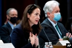 FILE - Director of National Intelligence Avril Haines, left, next to CIA Director William Burns, testifies on Capitol Hill in Washington, Oct. 27, 2021.