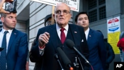 Former Mayor of New York Rudy Giuliani speaks during a news conference outside the federal courthouse in Washington, Dec. 15, 2023.