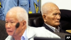 FILE - Khieu Samphan, left, former Khmer Rouge head of state, and Nuon Chea, Khmer Rouge's chief ideologist and No. 2 leader, before closing statements, U.N.- backed war crimes tribunal, Phnom Penh, Oct. 31, 2013.