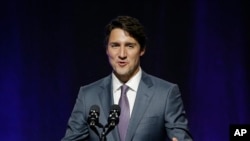 FILE - Canada's Prime Minister Justin Trudeau addresses a session at the second day of the National Governors Association meeting, July 14, 2017, in Providence, Rhode Island. 