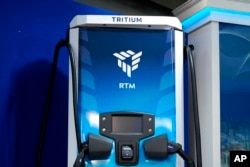 A Tritium electric vehicle charger is seen during an event with President Joe Biden in the South Court Auditorium in the Eisenhower Executive Office Building on the White House complex, Feb. 8, 2022.