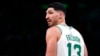 FILE - Boston Celtics center Enes Kanter Freedom looks toward the team's bench during the first half of an NBA basketball game Dec. 1, 2021, in Boston.
