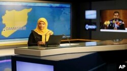 This undated photo provided by Iranian state television's English-language service, Press TV, shows American-born news anchor Marzieh Hashemi at studio in Tehran, Iran.