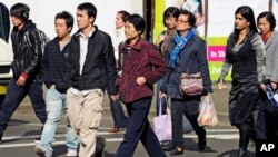 Shoppers walk through Sydney's Chinatown, August 2, 2010