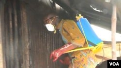 FILE - A humanitarian worker disinfects homes in Idabato, Cameroon, Nov. 28, 2019. (Moki Edwin Kindzeka/VOA)