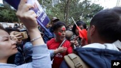 A pro-Beijing supporter yells at a photographer during a rally in Hong Kong on Dec. 7, 2019. 