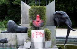 A statue of former Belgian King Leopold II has been vandalized, in the park of the Africa Museum, in Tervuren, near Brussels, Belgium, June 9, 2020.