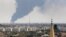Smoke rises over an oil depot in Libya's capital, Tripoli, as rival militias plague the nation's civilian populations.