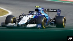 FILE - Williams driver Nicholas Latifi of Canada steers his car during the Sprint Race qualifying session at the Monza racetrack, in Monza, Italy , Saturday, Sept.11, 2021. The Formula one race will be held on Sunday. (AP Photo/Luca Bruno)