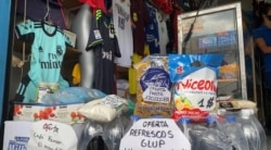 Este local, que siempre vendió ropa, decidió empezar ofrecer comida para mantenerse abierto. Caracas, Venezuela. Agosto, 2020. Foto: captura de video.