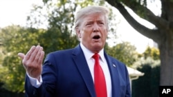 President Donald Trump speaks with reporters before departing on Marine One from the South Lawn of the White House, Sept. 16, 2019, in Washington. 