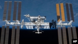 An undated photo provided by NASA shows the International Space Station in orbit. (NASA via AP)