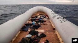FILE - Migrants' personal belongings lie in a rubber boat after the people were rescued by aid workers of the Spanish NGO Proactiva Open Arms, 60 miles north of Al-Khums, Libya, Feb. 18, 2018. The migrants had left Libya in an effort to reach European soil.