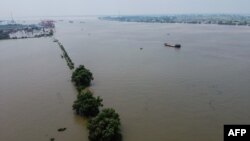 An aerial view shows the swollen Yangtze River in Jiujiang, in China's central Jiangxi province, on July 17, 2020.