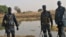 Police officers patrol in Kiir Adem in South Sudan, where six policemen were killed at the weekend in a raid blamed on nomads from Sudan. (Courtesy)