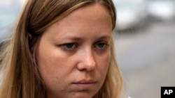 Russian journalist Maria Zholobova enters the police station in Moscow, Russia, June 29, 2021. Russian authorities recently raided homes of several investigative journalists and their family members, amid mounting pressure on Russia's independent media.