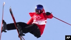 China's Eileen Gu competes during the women's halfpipe finals at the 2022 Winter Olympics, Feb. 18, 2022, in Zhangjiakou, China.