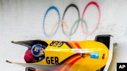 Laura Nolte and Deborah Levi, of Germany, compete in the women's bobsled competition at the 2022 Winter Olympics, Feb. 19, 2022, in Beijing.