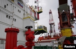 FILE - A section of an oil platform operated by Lukoil company is seen at the Kravtsovskoye oil field in the Baltic Sea, Russia, Sept. 16, 2021.
