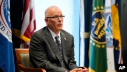 FILE - U.S. Customs and Border Protection Commissioner Chris Magnus speaks during an interview in his office with The Associated Press, Feb. 8, 2022, in Washington.