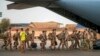 FILE - French Barkhane force soldiers leave their base on a transport plane in Gao, Mali, June 9, 2021, having completed a tour of duty. French President Emmanuel Macron announced at a press conference Feb. 17, 2022, that he is withdrawing French forces from the country.