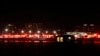 Lights from emergency vehicles are seen at Reagan National Airport in Washington, DC, after an air crash near the Potomac River on January 29, 2025.