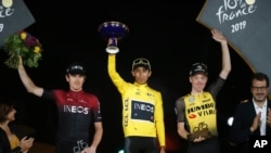 Colombia's Egan Bernal wearing the overall leader's yellow jersey climbs toward Val Thorens during the twentieth stage of the Tour de France cycling, July 27, 2019.