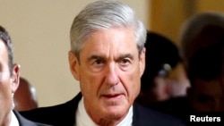 FILE - Special Counsel Robert Mueller departs after briefing members of the U.S. Senate on his investigation into potential collusion between Russia and the Trump campaign on Capitol Hill in Washington.