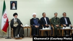 FILE - Iranian Supreme Leader Ayatollah Ali Khamenei, far left, meets with President Hassan Rouhani, second from left, and other members of the president’s Cabinet on Aug. 29, 2018.