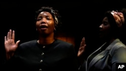 Thembisa Mdoda-Nxumalo, who plays on the role of Winnie, left, with Ayanda Sibisi perform during a rehearsal of the play "The Cry of Winnie Mandela" at Market Theatre in Johannesburg, South Africa, Feb. 26, 2025.