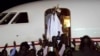Gambia's defeated leader Yahya Jammeh waves to supporters as he departs from Banjul airport, Jan. 21, 2017. Jammeh announced he has decided to relinquish power, after hours of last-ditch talks with regional leaders and the threat by a regional military force to make him leave.