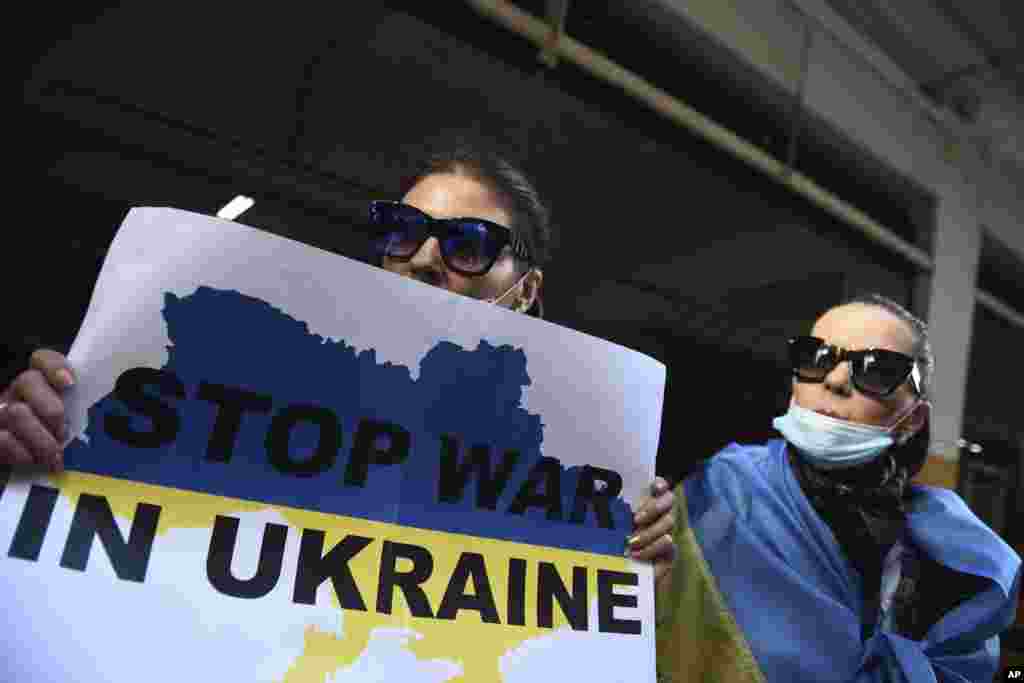 Ukrainians who live in Greece protest outside the Russian Consulate in the northern port city of Thessaloniki, Greece, Feb. 24, 2022. 