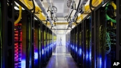 In this undated file photo made available by Google shows the campus-network room at a data center in Council Bluffs, Iowa. 