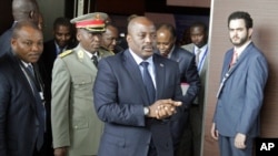 FILE - Democratic Republic of Congo President Joseph Kabila arrives for an African leaders' meeting to discuss the political crisis his country, in Luanda, Angola, Oct. 26, 2016. Tensions in the DRC are running high after a controversial deal extended Kabila's term in office by nearly a year and a half.