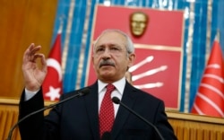 FILE - Turkey's main opposition Republican People's Party (CHP) Leader Kemal Kilicdaroglu addresses his party MPs during a meeting at the Turkish parliament in Ankara April 8, 2014.