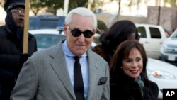 FILE - Roger Stone, accompanied by his wife Nydia Stone, arrives at federal court in Washington, Nov. 14, 2019.