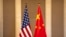 FILE — Undated photo of flags of the U.S. and China. An international military forum in China next week is expected to provide an opportunity for military-to-military contact between the U.S. and China.