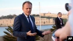 European Council President Donald Tusk speaks with the media prior to an EU summit outside his hotel in Valletta, Malta on Feb. 2, 2017. 
