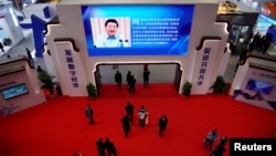 FILE - China's President Xi Jinping is shown on a screen during the fourth World Internet Conference in Wuzhen, Zhejiang province, China, December 4, 2017. 