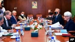 In this Pakistan Ministry of Foreign Affairs photo, U.S. Deputy Secretary of State Wendy Sherman, right, meets with Pakistan's Foreign Minister Shah Mahmood Qureshi, second left, at the Ministry of Foreign Affairs in Islamabad, Oct. 8, 2021.
