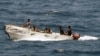 In this U.S. Navy photo, pirates leave the Ukrainian merchant vessel MV Faina for Somalia's shore Wednesday, Oct. 8, 2008 while under observation by a U.S. Navy ship. The MV Faina, which was carrying a cargo of Ukrainian T-72 tanks and related military eq