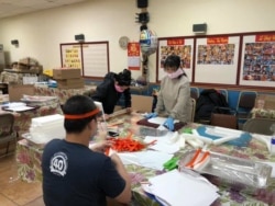 Team members work on face shields at Thanh Tinh Buddhist Temple, April 19, 2020. Around 1,000 face shields were made that weekend, according to the temple's Facebook account. (Photo courtesy of Dinh Tran Tuan)